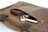 Front pocket carries small gadgets without bulging